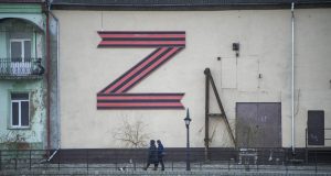 Inside Nato’s frontier with Putin where short bridge crosses border like Berlin Wall as Russians taunt West with Z sign